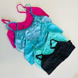 Assortment of girl’s sports bras. Assortment of color and sizes.